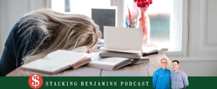 woman sleeping with head on her desk