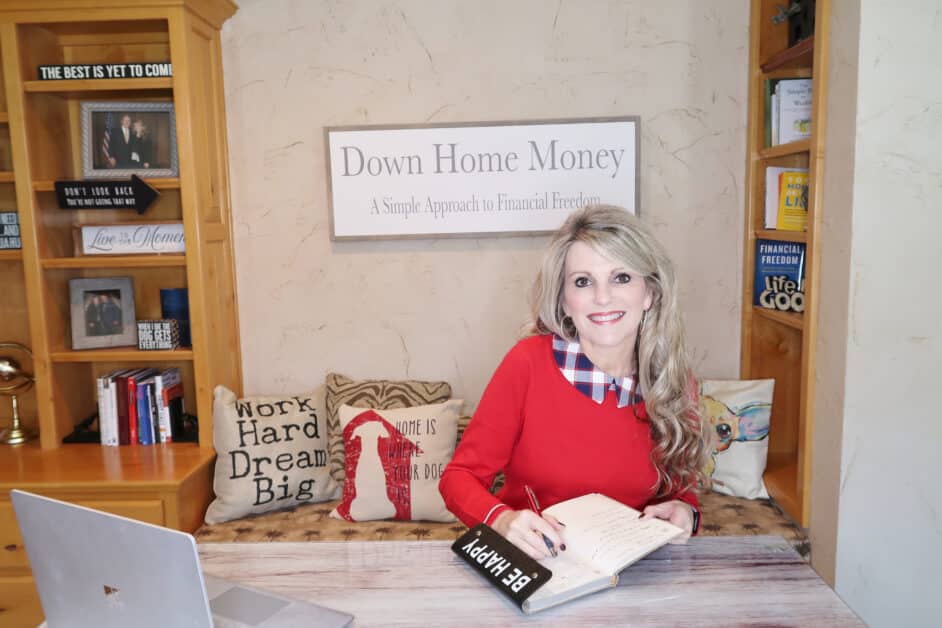 Photo of Myra Oliver with book, Down Home Money